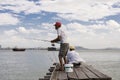 Penang, Malaysia, December 19 2017: Two Fishermen waiting for the catch of the day