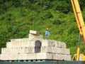 Construction workers stacking the maintain load test block also known as MLT test at the construction site. Royalty Free Stock Photo