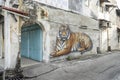 PENANG, MALAYSIA - 30 JULY 2017:Tiger mural, a tiger in a resting position on the wall, Chulia Street, George Town.