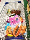 Groceries that have been picked up are placed in the cart before payment is made at the payment counter.