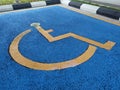 Parking for the disabled. The parking lot has a blue background and has a special logo.