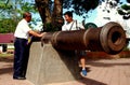 Penang, Malaysia: Tourists with 18th Century Cannon