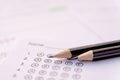 Pencil on answer sheets or Standardized test form with answers bubbled. multiple choice answer sheet Royalty Free Stock Photo