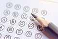 Pencil on answer sheets or Standardized test form with answers bubbled. multiple choice answer sheet Royalty Free Stock Photo