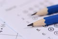 Pencil on answer sheets or Standardized test form with answers bubbled. multiple choice answer sheet Royalty Free Stock Photo