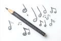 Pencil with black eraser on white background. Musical notes scattered, overlapping, creating sense of depth, complexity. Graphite Royalty Free Stock Photo