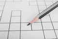 Pencil and blank crossword, closeup view. Space for text