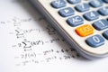 Pencil and calculator on mathematic formula exercise test paper in education school Royalty Free Stock Photo