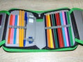 Pencil case with colored pencils, crayons, pen, eraser, sharpener. School concept Royalty Free Stock Photo