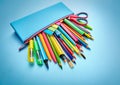 The pencil case is filled with pens, pencils and stickers. Royalty Free Stock Photo