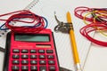 Pencil and compass, notebook and calculator on a white background