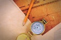 Pencil, compass and vintage map on a wooden table. Royalty Free Stock Photo