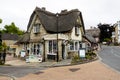 Pencil Cottage Shop and Old Thatch Tea Shop with garden and thatched roof Royalty Free Stock Photo