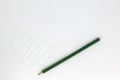Pencil drawing green zigzag on white paper . Royalty Free Stock Photo