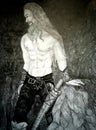 Pencil drawing, a Norse warrior near a rock