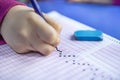 Hand student testing in exercise and taking fill in exam carbon paper computer sheet with pencil at school test room, education Royalty Free Stock Photo