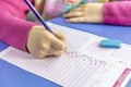 Hand student testing in exercise and taking fill in exam carbon paper computer sheet with pencil at school test room, education Royalty Free Stock Photo