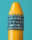 Macro View of a Yellow Crayon Tip with Textured Silver Grip Royalty Free Stock Photo