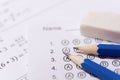 Pencil and eraser on answer sheets or Standardized test form with answers bubbled. multiple choice answer sheet Royalty Free Stock Photo