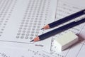 Pencil and eraser on answer sheets or Standardized test form with answers bubbled. multiple choice answer sheet Royalty Free Stock Photo