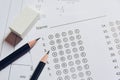 Pencil and eraser on answer sheets or Standardized test form with answers bubbled. multiple choice answer sheet Royalty Free Stock Photo