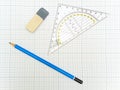 Pencil and eraser at the plotting paper Royalty Free Stock Photo