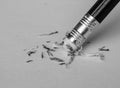 Pencil eraser removing a written mistake on a piece of paper. Royalty Free Stock Photo