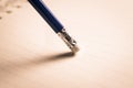 pencil eraser removing a written mistake on a piece of paper, de Royalty Free Stock Photo