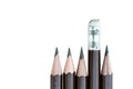 Pencil eraser standing out from row of pencils. Royalty Free Stock Photo