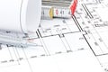 Pencil and folding ruler on architectural blueprint floor plan