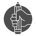 Pencil in hand solid icon, art concept, large pencil in hand sign on white background, hand holds pencil icon in glyph Royalty Free Stock Photo