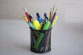 Pencil holder with pens, pencils and markers Royalty Free Stock Photo