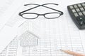 Pencil and house on finance account with spectacles and calculator Royalty Free Stock Photo