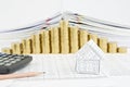 Pencil and house with step pile of gold coins Royalty Free Stock Photo