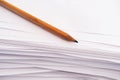 A pencil lies on a stack of paper sheets Royalty Free Stock Photo