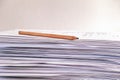 A pencil lying on a stack of paper sheets Royalty Free Stock Photo