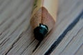 Pencil lying on the table in a large approximation