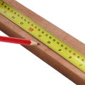 Pencil marking wood with steel measure on white background