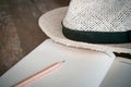 Pencil note book White hat on old wood table1 Royalty Free Stock Photo