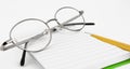 Pencil, notebook and glasses in composition Royalty Free Stock Photo
