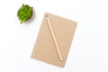 Pencil and notebook of kraft paper on a white background. Scand Royalty Free Stock Photo