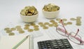 Pencil on notebook and spectacles with coins put as money Royalty Free Stock Photo