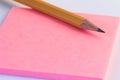 Pencil and a paper note up close. Simple pencil and paper note. Royalty Free Stock Photo