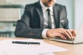 Pencil and paper on office desk, businessman working on laptop computer Royalty Free Stock Photo