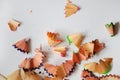 Pencil peels from sharpening colored pencils on a light background Royalty Free Stock Photo