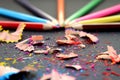Colored pencils sharp sharpened lie on a table with rubbish Royalty Free Stock Photo