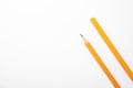 Pencil with point and unsharpened one on background white, top view. Space for text Royalty Free Stock Photo