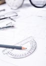 Pencil with a protractor against the background of the engineer's desk Royalty Free Stock Photo