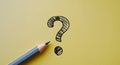 A pencil and a question mark scribble on a yellow background Royalty Free Stock Photo