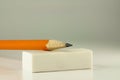 Pencil resting on a white eraser Royalty Free Stock Photo